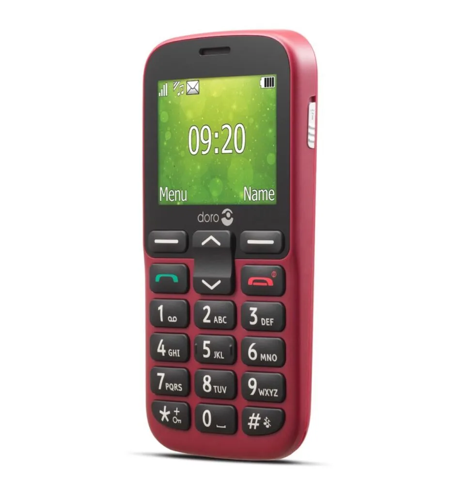 Doro 1380 phone on a table next to a cup of coffee. (Alt Text: Doro 1380 phone: Reliable and convenient communication for seniors