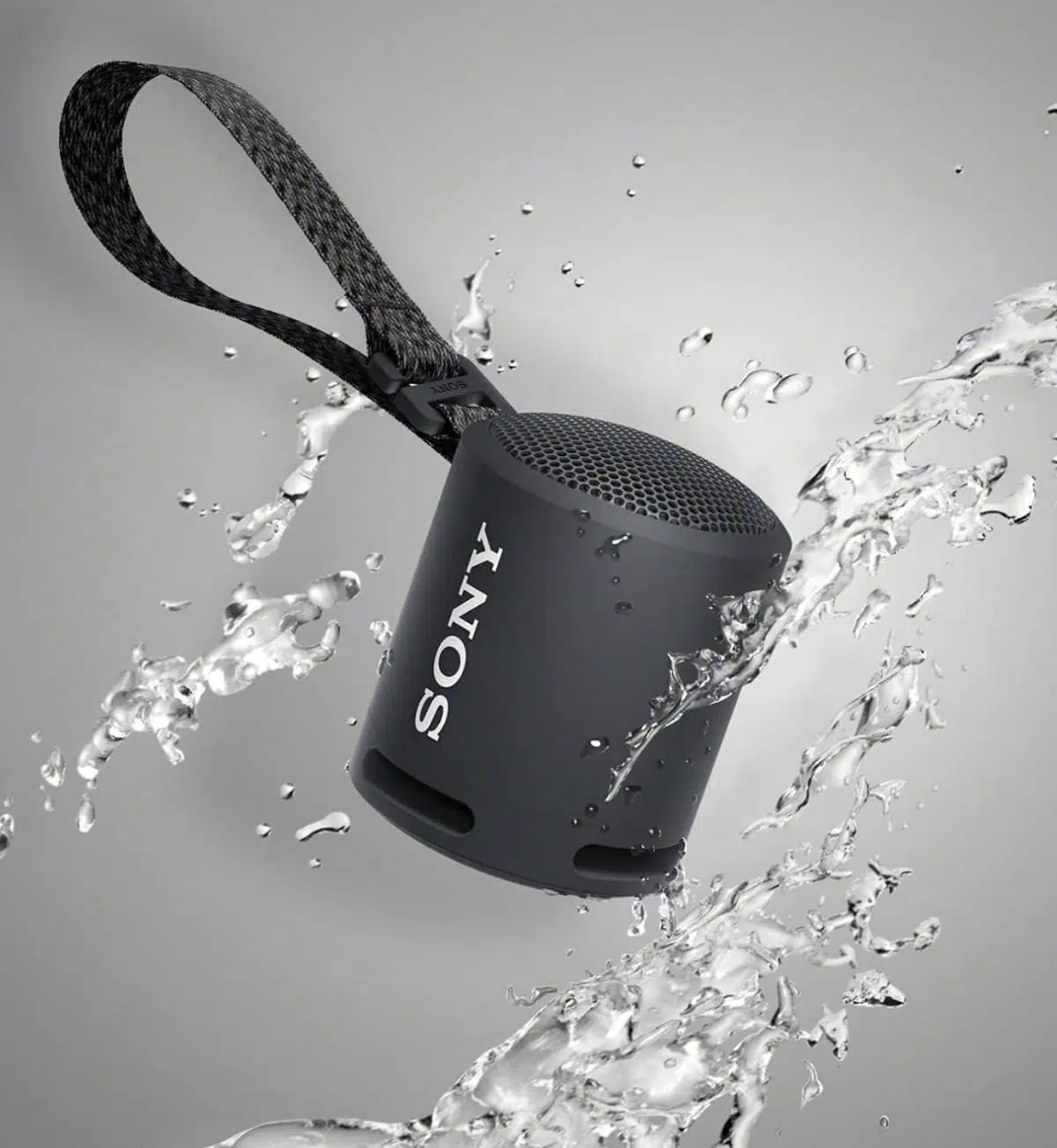Detailed close-up of a black Sony SRS-XB13 wireless speaker, showcasing its buttons and connection ports.